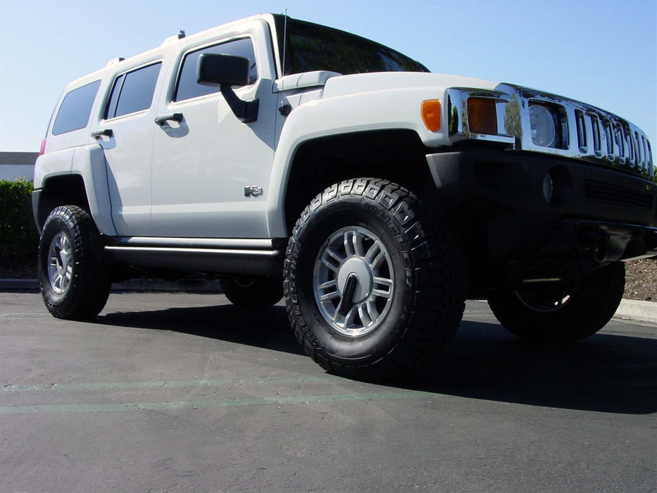 AMP Research 75116-01A PowerStep™; Incl. Light Kit; Minor Cutting Required; Black; - Truck Part Superstore