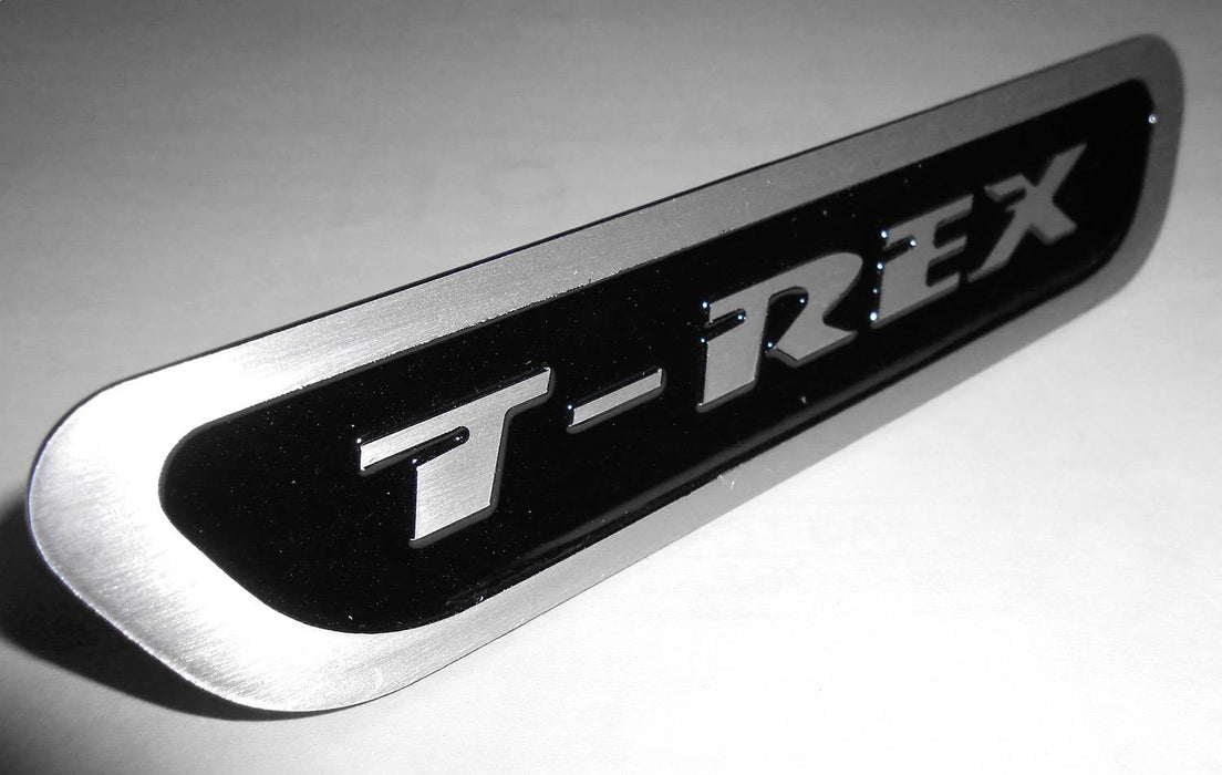 T-Rex Grilles L1016 T-Rex Series Logo Badge; Aluminum; Black; 1 Pc; Bolt-On; - Truck Part Superstore
