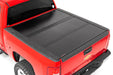 Rough Country 47113550 Low Profile Hard Tri-Fold Tonneau Cover 07-13 1500 5.5 Foot Bed W/O Rail Caps Rough Country - Truck Part Superstore